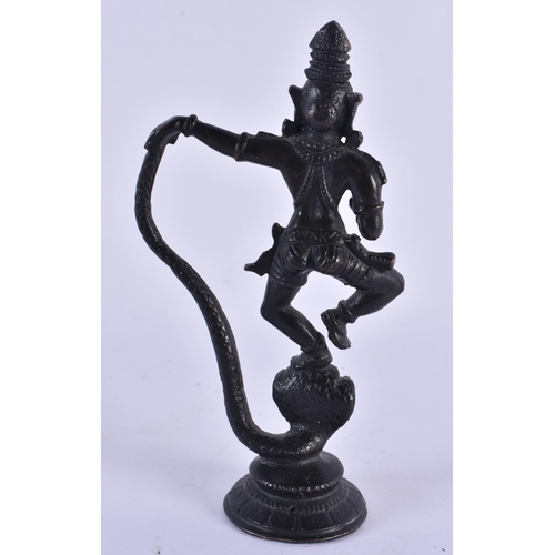 1074 - A 19TH CENTURY INDIAN BRONZE FIGURE OF A DEITY. 9.5 cm high.