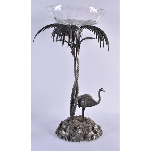 1077 - A LARGE 19TH CENTURY SILVER PLATED CUT GLASS COMPORT Attributed to Elkington & Co, formed as an emu ... 