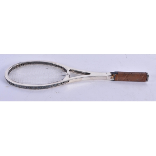 1079 - A VINTAGE SILVER TENNIS RACKET. 28 cm x 8 cm.