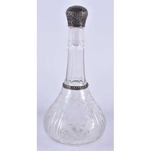 1081 - AN ANTIQUE SILVER MOUNTED ENGRAVED GLASS DECANTER. 713 grams. 26 cm x 12 cm.