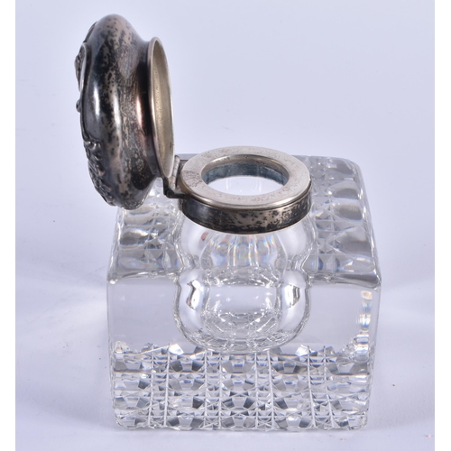 1102 - AN ANTIQUE SILVER MOUNTED CUT GLASS INKWELL. 10 cm x 8 cm.