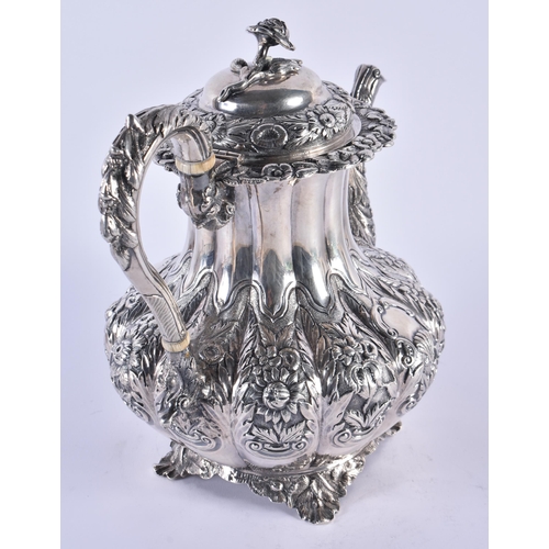 1106 - A GEORGE III IRISH SILVER REPOUSSE COFFEE POT. Dublin 1832. 1158 grams. 27 cm x 24 cm.