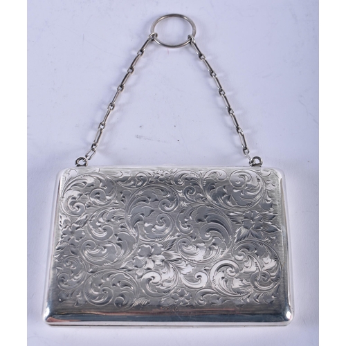 1118 - AN ANTIQUE SILVER ENGRAVED PURSE. 98 grams. 10 cm x 7 cm.