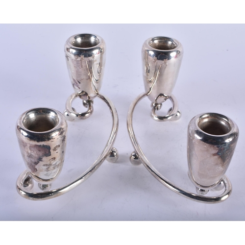 1123 - A STYLISH PAIR OF SILVER CANDLESTICKS. 535 grams. 17 cm x 6.5 cm.