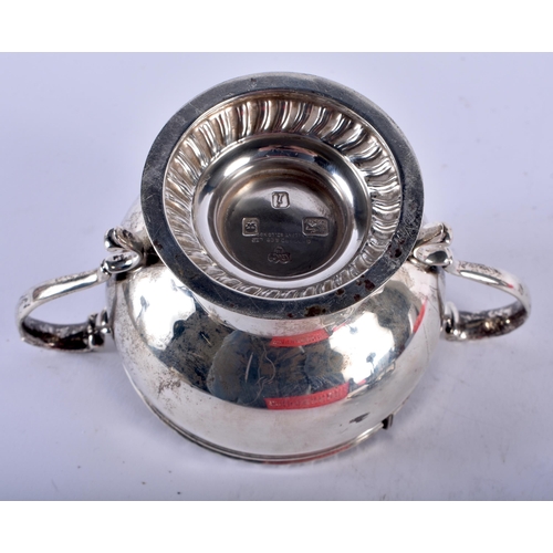 1128 - A TWIN HANDLED SILVER POT POURRI AND COVER together with a silver chamberstick. London 1964 etc. 317... 