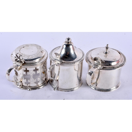 1133 - THREE ANTIQUE SILVER MUSTARD POTS. London 1832 etc. Silver 330 grams. Largest 9 cm x 8.5 cm. (3)