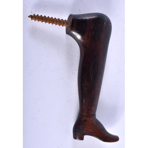 1155 - AN EARLY 19TH CENTURY CONTINENTAL CARVED WOOD TREEN LEG CANE HANDLE. 9 cm x 7 cm.