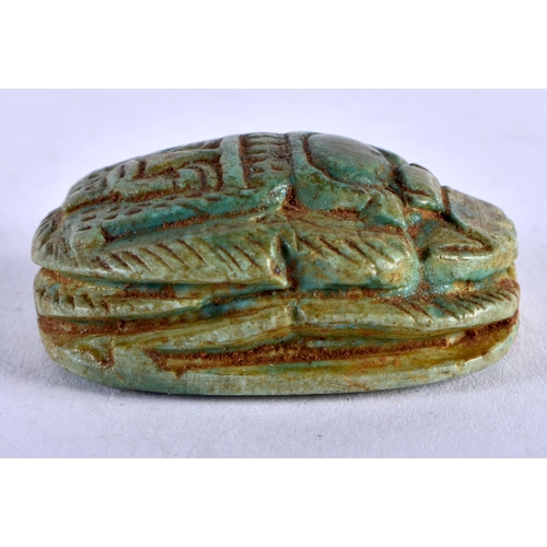 1159 - AN EGYPTIAN FAIENCE SCARAB BEETLE AMULET. 13 grams. 3 cm x 2 cm.