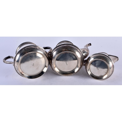 1165 - AN ANTIQUE RUSSIAN THREE PIECE SILVER TEASET. 810 grams. Largest 17 cm x 14.5 cm. (3)