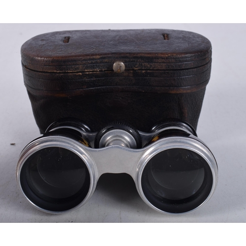 1223 - A PAIR OF ANTIQUE TORTOISESHELL OPERA GLASSES. 7 cm x 10 cm.