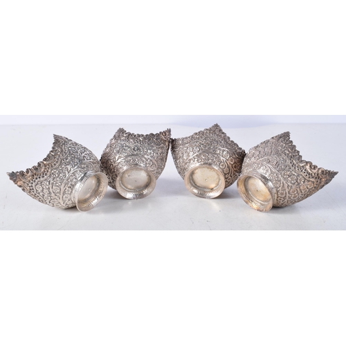 1235 - A LOVELY SET OF FOUR 19TH CENTURY INDIAN SILVER SALTS decorated with foliage. 162.5 grams. 7.75 cm x... 