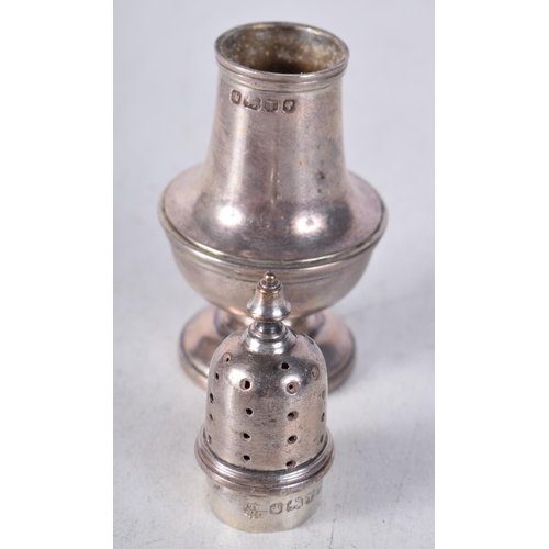 1240 - AN UNUSUAL MINIATURE VICTORIAN SILVER PEPPER POT. Sheffield 1886. 24.5 grams. 7.25cm x 3 cm.