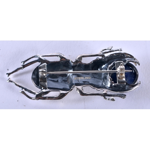 1254 - A Sterling Silver and Lapis Stag Beetle Brooch. Stamped Sterling. 5.6cm x 2.1cm, weight 13.1g