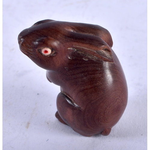 1257 - A Japanese Carved Hardwood Netsuke in the Form of a Hare. 4.3cm x 3cm x 2.4cm, weight 16.3g