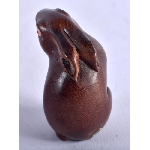 1257 - A Japanese Carved Hardwood Netsuke in the Form of a Hare. 4.3cm x 3cm x 2.4cm, weight 16.3g