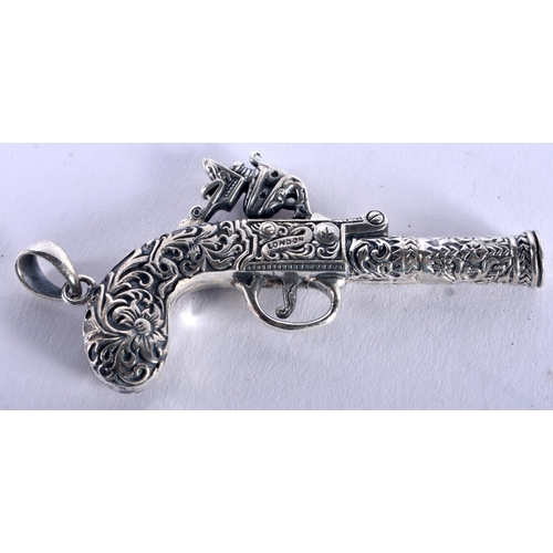 1270 - A Novelty Pendant Whistle in the form of a Flintlock. Stamped Sterling. 3.3cm x 7.1cm, weight 21.5g