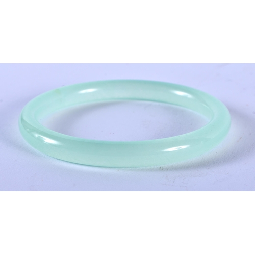 1279 - An Icy Jade Bangle. 6.2cm Internal Diameter, weight 27.9g