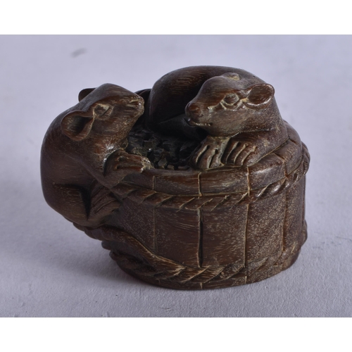 1285 - A Carved Hardwood Netsuke in the form of Rats climbing over a Barrel. 3.1cm x 4.1cm x 3cm, weight 23... 