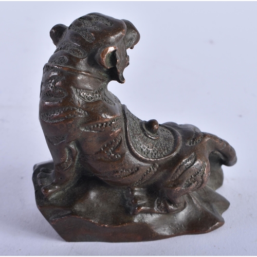 1301 - A Chinese Bronze Guardian Lion. 7.4cm x 7.4cm x 4cm, weight 292g