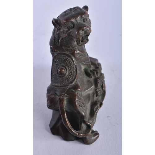 1301 - A Chinese Bronze Guardian Lion. 7.4cm x 7.4cm x 4cm, weight 292g