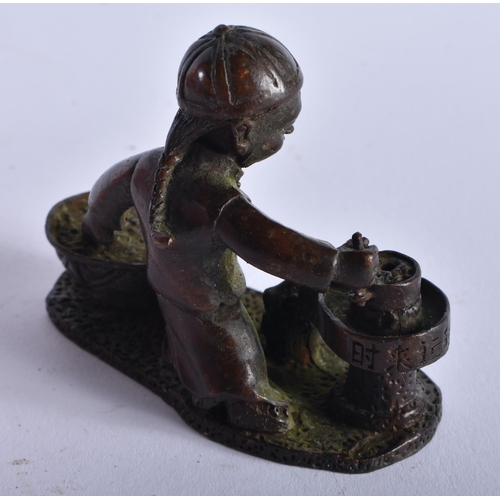 1302 - A Japanese Bronze Figure of a Boy Grinding Rice. 6cm x 7.5cm x 3.3cm, weight 212g