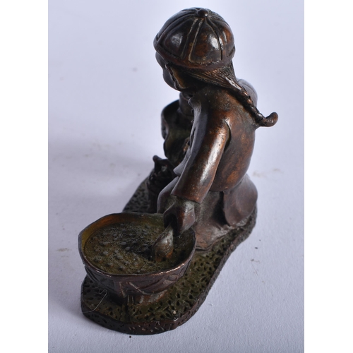 1302 - A Japanese Bronze Figure of a Boy Grinding Rice. 6cm x 7.5cm x 3.3cm, weight 212g