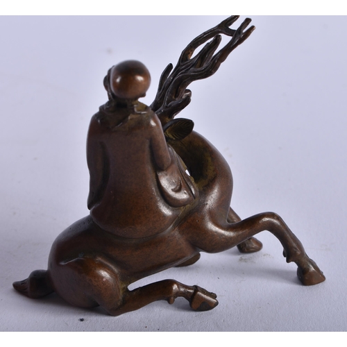 1304 - A Chinese Bronze of Shoulao Seated on a Deer. 6.5cm x 7.5cm x 3.6cm, weight 172g