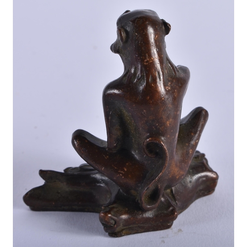 1305 - A Seated Bronze Monkey. 5.6cm x 3cm x 5.5cm, weight 159g