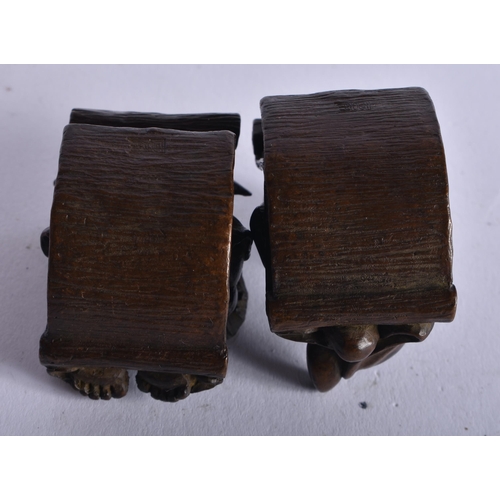 1306 - A Pair of Mythical Pigs in Rocking Chairs. 4.2cm x 2.8cm x 4.2cm, total weight 299g (2)