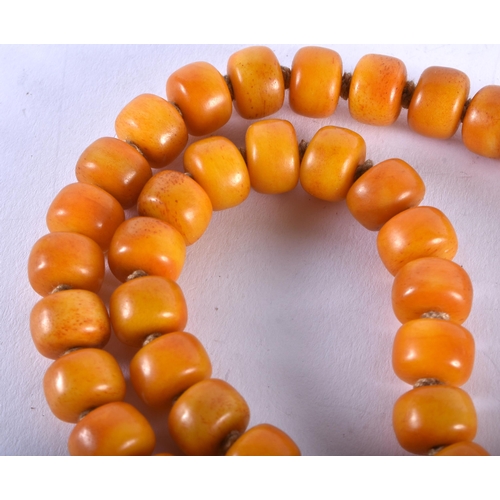 1311 - A Butterscotch Amber Type Bead Necklace. 112cm long, bead size 11.9mm, weight 178g