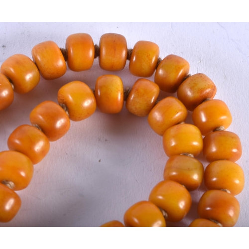 1311 - A Butterscotch Amber Type Bead Necklace. 112cm long, bead size 11.9mm, weight 178g