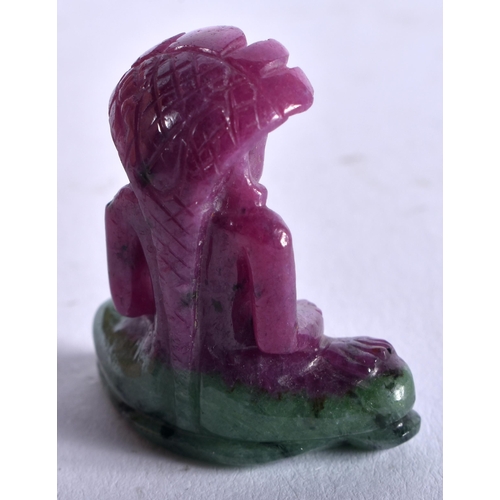 1328 - AN INDIAN CARVED RUBY AND JADE DEITY. 12.3 grams. 3 cm x 2.75 cm.