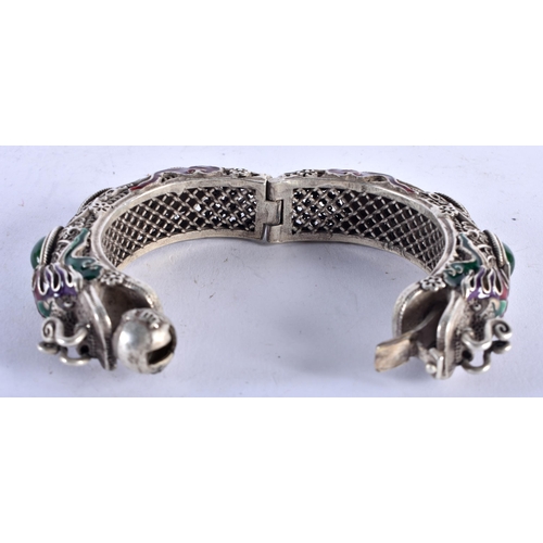 1329 - A CHINESE WHITE METAL AND ENAMEL BANGLE. 136 grams. 6 cm wide.