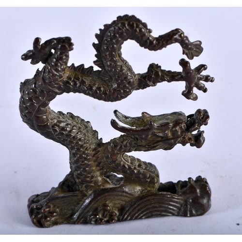 1344 - A JAPANESE BRONZE DRAGON OKIMONO. 158 grams. 8.25cm x 7 cm.