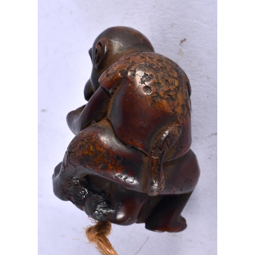 1349 - A JAPANESE CARVED WOOD MONKEY NETSUKE. 24 grams. 4.25cm x 3 cm.