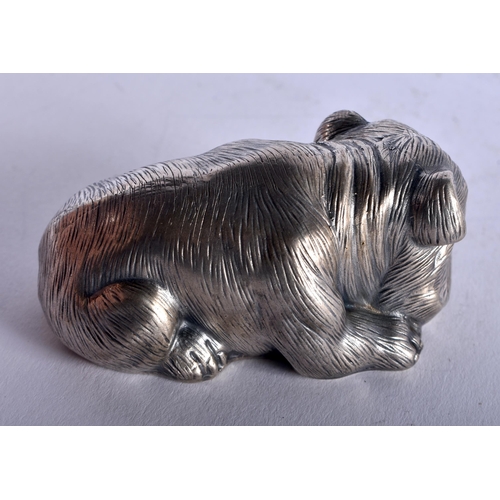 1352 - A CONTINENTAL SILVER RUBY EYED DOG. 58 grams. 6.5 cm x 3.5 cm.