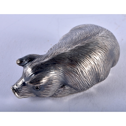 1353 - A CONTINENTAL SILVER RUBY EYED PIG. 30 grams. 6 cm x 3 cm.