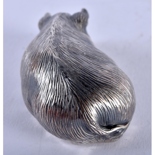 1353 - A CONTINENTAL SILVER RUBY EYED PIG. 30 grams. 6 cm x 3 cm.