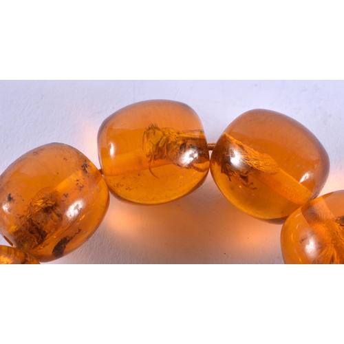 1357 - A CONTINENTAL AMBER BRACELET. 71 grams. 6 cm internal width.