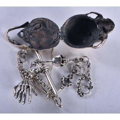 1374 - A SILVER SKULL ON CHAIN. 60 grams. 34 cm long.