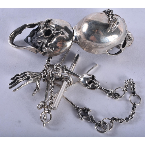 1374 - A SILVER SKULL ON CHAIN. 60 grams. 34 cm long.