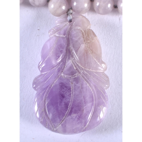 1393 - A CHINESE LAVENDER JADE NECKLACE. 76.4 grams. 69 cm long.