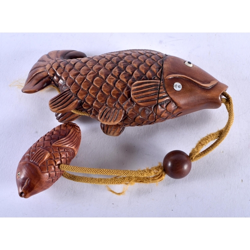 1395 - A JAPANESE CARVED WOOD FISH INRO. 66.5 grams. 11 cm x 5 cm.