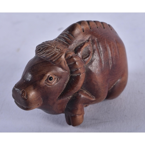 1403 - A JAPANESE BOXWOOD RAM NETSUKE. 27.5 grams. 3.75 cm x 6.5 cm.