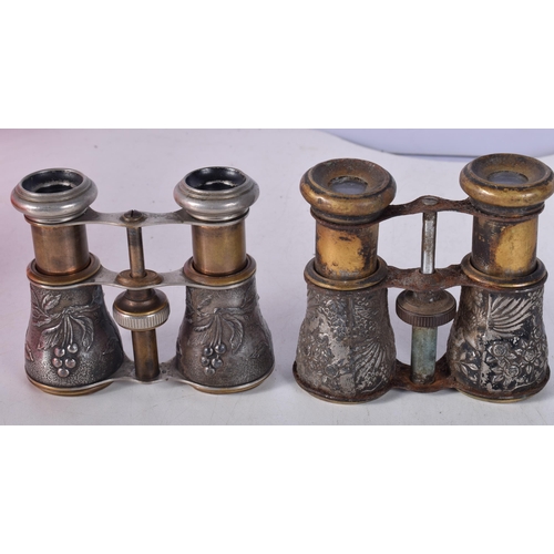 1442 - Two Pairs of Opera Glasses with Embossed White Metal Barrels. 10.4cm x 9cm x 4.3cm