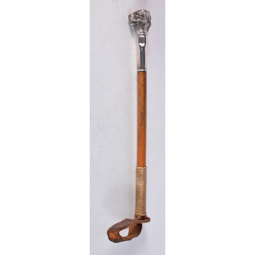 1443 - A Victorian Riding Crop with a Silver Dogs Head Top.36 cm long, Hallmarked London 1896, weight 71g