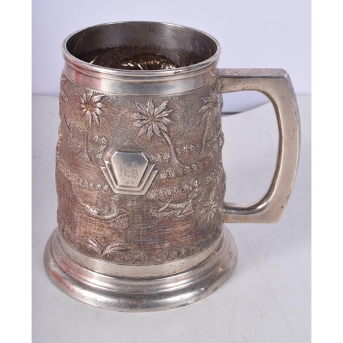 1444 - A Large Indian Sterling Silver heavily embossed Tankard. Stamped Sterling. 12cm x 14cm x 11cm. Weigh... 