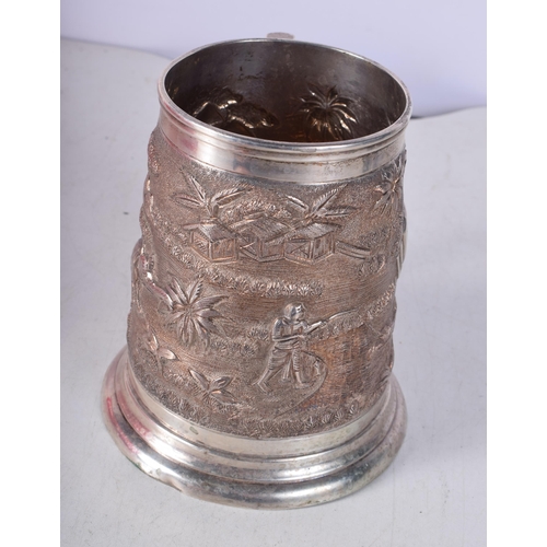 1444 - A Large Indian Sterling Silver heavily embossed Tankard. Stamped Sterling. 12cm x 14cm x 11cm. Weigh... 