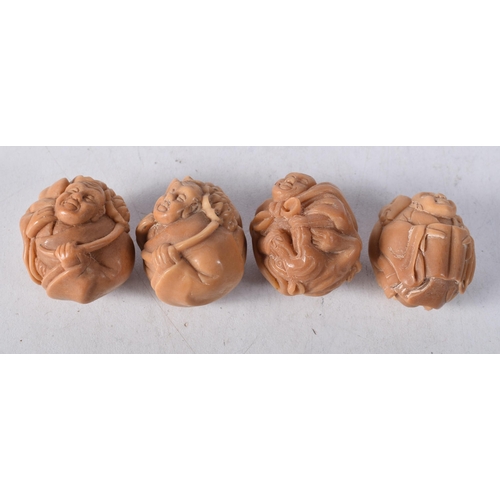 1448 - Four Nuts Carved with Figures. 3.3cm x 2.8cm x 2.7cm, total weight 58g (4)