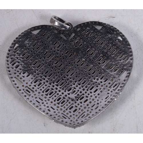 1450 - A Silver Heart Pendant set with Diamonds. Stamped 925. 4.2cm x 4.2cm, weight 11.9g